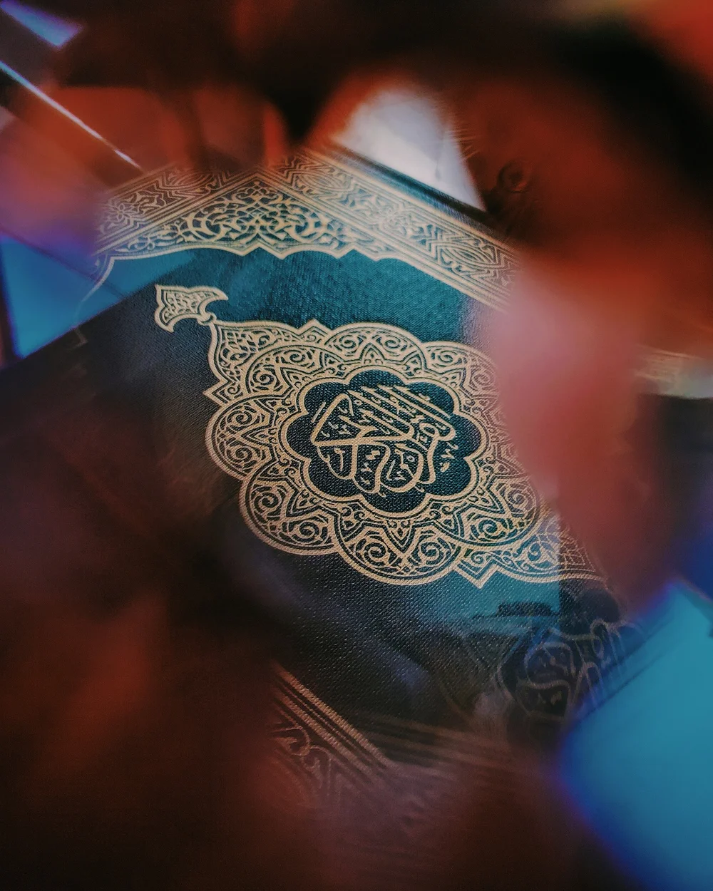 A Qur’an with an ornate blue and gold cover
